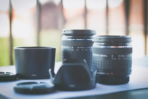 Close-Up of Camera Lenses on Table with Soft Focus Stock Photos