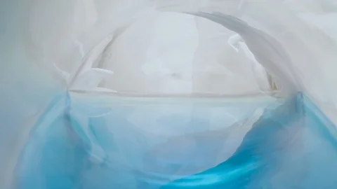 Close-up camera makes a zoom into a glass flask Stock Footage 128233668