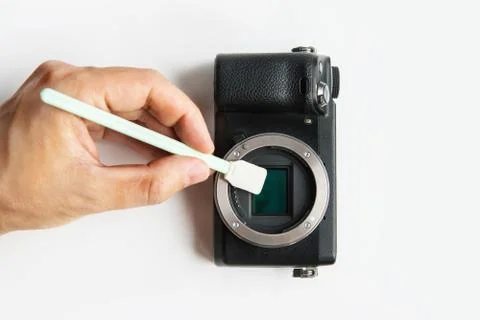 Close-up of camera matrix cleaning, technician pov. Stock Photos