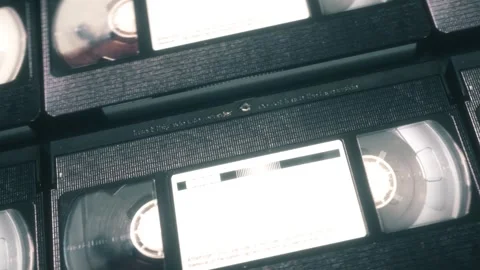 Close-Up Camera Movement Across Analog Video Tapes With Nostalgic Mood Stock Footage 346073450
