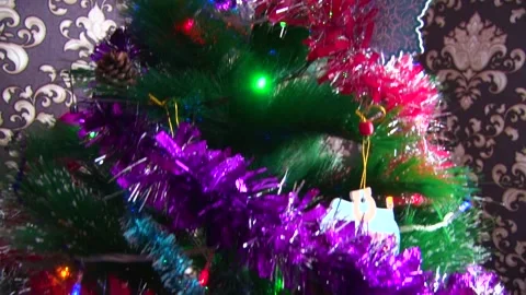 Close-up camera movement along the tree starts from the star and down Stock Footage 145575775