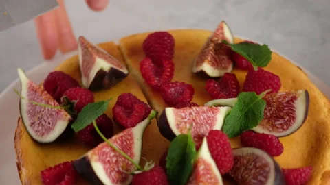 Close-up. Camera movement. Female hands decorate the cake. Delicious homemade Stock Footage 147038101