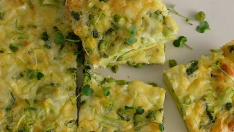 Close-up camera movement. Frittata with broccoli on a plate. Italian breakfast Video stock 146923618
