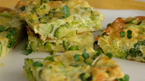 Close-up camera movement. Frittata with broccoli on a plate. Italian breakfast Video stock 146923907
