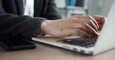Close up of camera moving behind male hands typing text on laptop keyboard Stock Footage 147051281