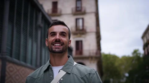 Close up camera rotation young Caucasian handsome man strolling happy in Stock Footage 271157161