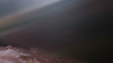 Close-up camera slowly moving between knife cuts vegetables and raw chicken Stock Footage 130997611