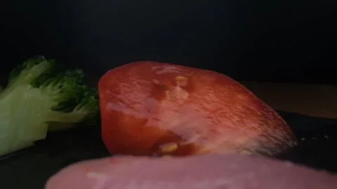 Close-up camera slowly moving between vegetables and raw chicken,water splash Stock Footage 131609320
