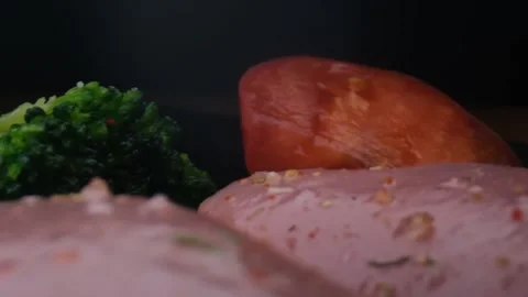 Close-up camera slowly moving between vegetables and raw chicken,water splash Stock Footage 131609807