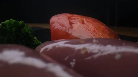 Close-up camera slowly moving between vegetables and raw chicken,healthy food Stock Footage 131610050