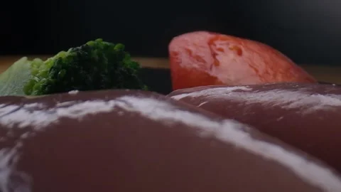 Close-up camera slowly moving between vegetables and raw chicken,healthy food Stock Footage 131610246