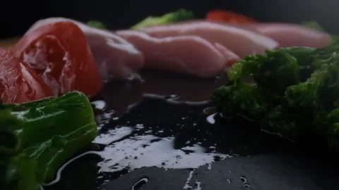 Close-up camera slowly moving between vegetables and raw chicken,healthy food Stock Footage 131610340