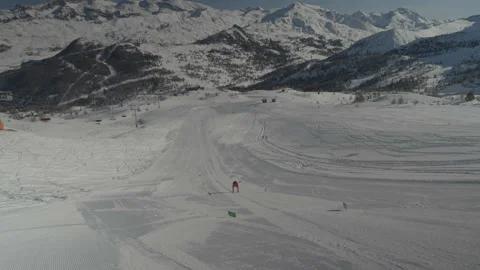 Close-up camera tracking red skier's feet Stock Footage 346056191