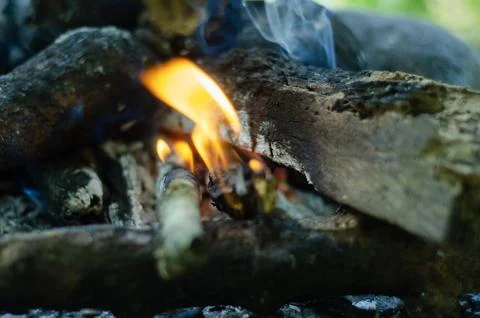 Close Up of a Campfire Burning with Orange Flames and Smoke Stock Photos