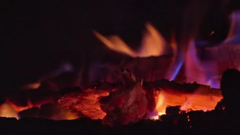 Close-up of a campfire with glowing coals at night. Video with sound. Stock Footage 313402621