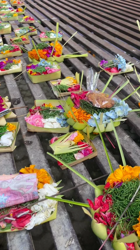 Close-up of Canang Sari, small offering baskets at a temple in Ubud, Bali Stock Footage 287985636