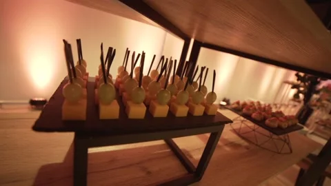 Close-up of canapes on the modern buffet at the party. Decorated party area Stock Footage 171984659