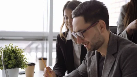 Close up of candid creative businessman working in office and discussing start 스톡 동영상 103078593