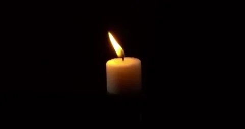Close-up of candle burn with glow flame fire sparkle on black background Video stock 319020676