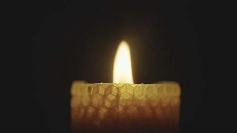 Close-up of a candle burning in the dark. Mystical atmosphere. Light in the dark Stock Footage 233189461