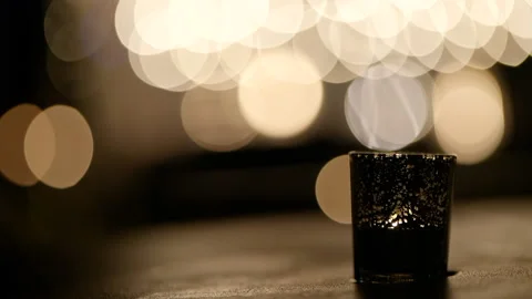 Close up candle in cup bokeh lights background Stock Footage 170375335