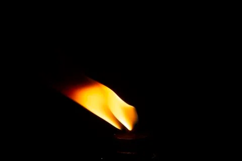 Close up on candle fire on black background 写真素材