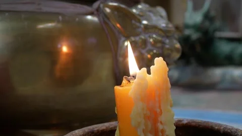 Close up to candle with fire glow flame light up in chinese temple shrine Stock Footage 259788791