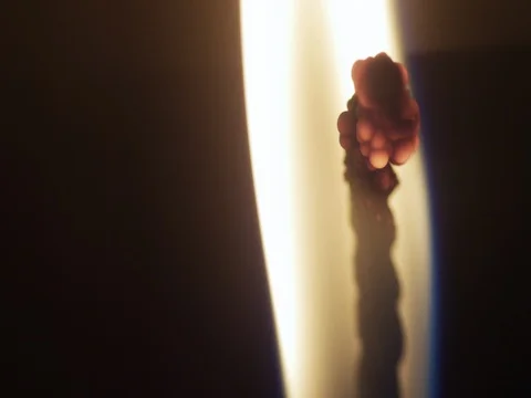 Close-up of a candle flame on a black background. Macro shot of candle wick. 動画素材 70724103