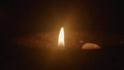 Close-up of Candle Flame Burning on Dark Surface Stock Footage 336545277