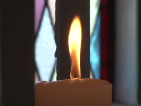 Close up of candle flame. center frame, flickering in church Stock Footage 296402361
