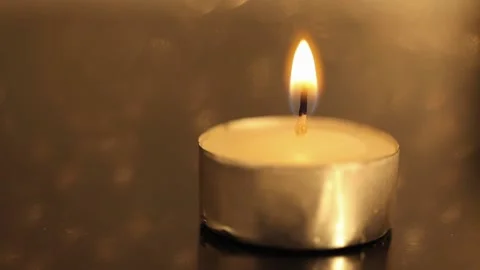 Close up of a candle with a flame of fire Stock Footage 221213091