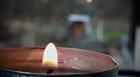 Close up of a candle flame on loop. Stock Footage