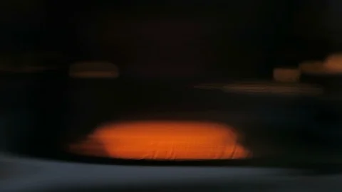 Close up of candle flame through glass optical distortion makes it abstract￼ Stock Footage 119077227