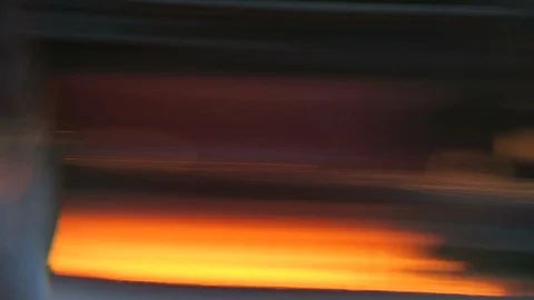 Close up of candle flame through glass optical distortion makes it abstract￼ Stock Footage 119077489