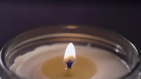 Close-up of a candle getting blown out with a trail of smoke Video stock 119096452
