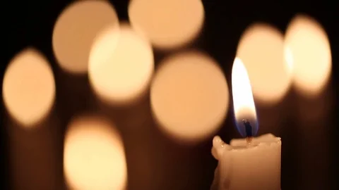 Close-up of a candle group at night Vídeo Stock 79079800