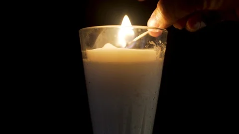 Close up a candle lighting on in a black background Stock Footage 96467554