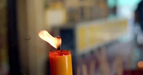 Close-up of a candle in the temple.A burning candle on the background. Stock Footage 254197688