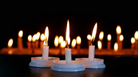 Close up  candlelight blurred on dark Background. Stock Footage 151870223
