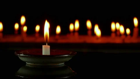 Close up candlelight blurred on dark Background. Stock Footage 151870250