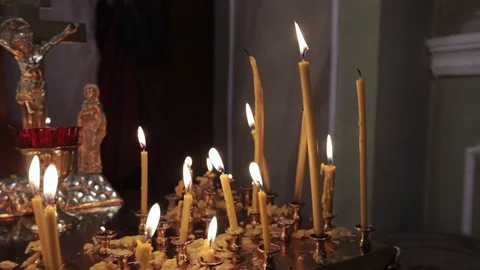 A close-up of candles burning in the temple Stock Footage 88859220