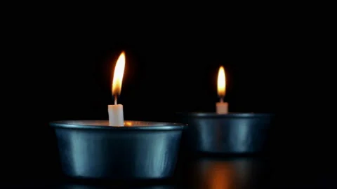 Close up candles flame on black shiny paper on dark Background. Video stock 151178672