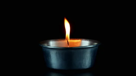 Close up candles flame Isolated on dark Background. Stock Footage 151490628