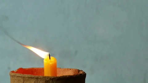 Close up candles flame on old concrete wall. Stock Footage 150840552