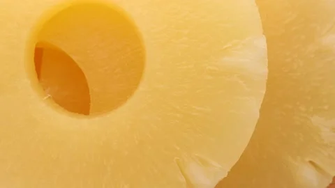 Close up of canned pineapple rings, rotation in circle. pineapple Turning. Stock Footage 232898573