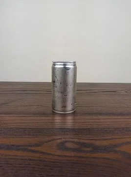 Close up cans of cold energy drinks on a wooden table Stock Photos