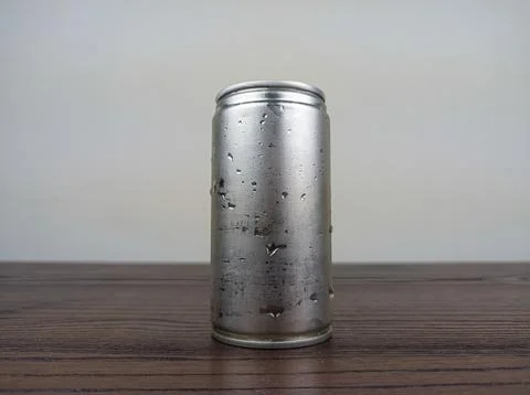 Close up cans of cold energy drinks on a wooden table Stock Photos