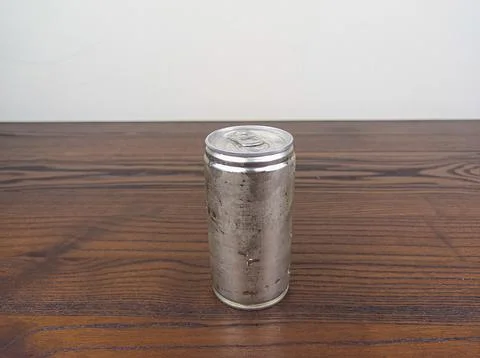 Close up cans of cold energy drinks on a wooden table Stock Photos