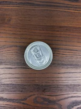 Close up cans of cold energy drinks on a wooden table Stock Photos