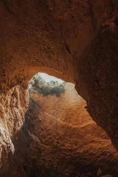 A close up of a canyon with light going through a crack Stock Photos